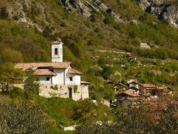 parish church at the foot of a mountain in Italy