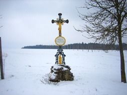 Snowy wayside cross