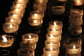 candles in glass cups in a church