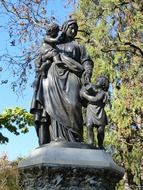 stone statue of mary with children