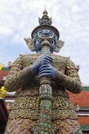 statue of a demon in the grand palace in thailand