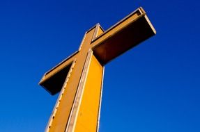 large cross against a bright blue sky