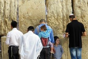 people near the wall for prayer in jerusalem