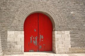 red door as entrance to a chinese temple