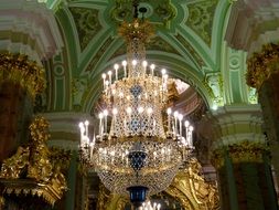 Crystal chandelier under the arches of the palace in St. Petersburg