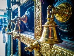 golden bells on door of Hindu temple, singapore