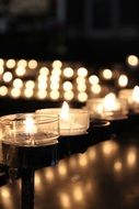 candles in glass candlesticks in a church