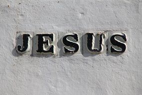 Nameplate "Jesus' on the ceramic wall