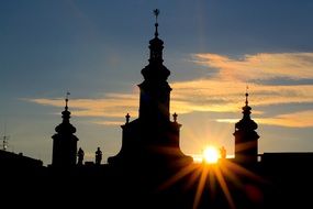 bright sun over a cathedral in the Czech Republic at sunset