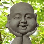 buddha statue and green leaves
