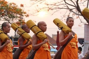 Walk of Buddhist monks in orange robes