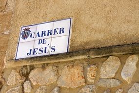 religious sign on a building wall