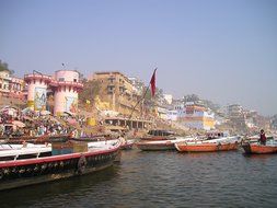 boats anchored in harbor on the ganges river, india