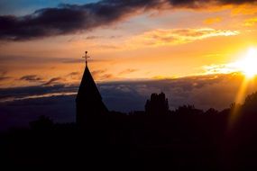tower of a church at sunset in geldermalsen