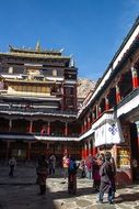 people near monastery, china, tibet, shigatse