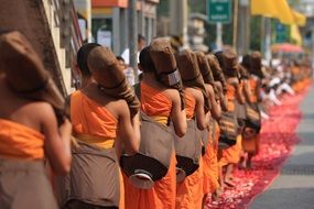 Buddhist monks in orange robes at the ceremony in Thailand