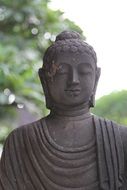 portrait of gray stone buddha statue