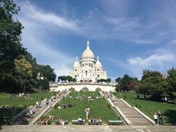 green fields in front of a church in Paris