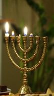 golden menorah with candles