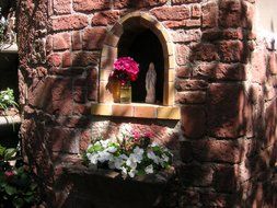 statue of saint mary in the shade of the garden