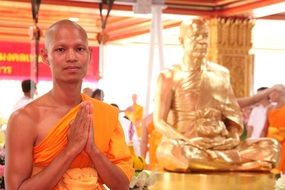 buddhist near the buddha statue