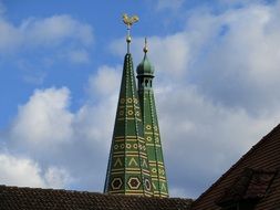 green spiers above rooftops