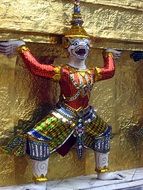 golden religious statue in a temple in Thailand