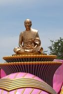 Golden Buddha statue at the temple in Asia