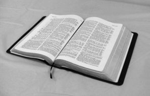 open bible on white table