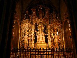 Big gold altar with Holy Maria in church