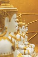 golden statues in a row in Thailand