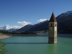 spire of the church in the lake