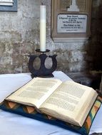 Church altar candle and book