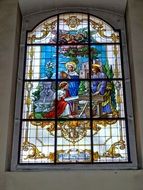 stained glass window with a picture of Jesus Christ
