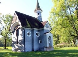 chapel cross on green grass