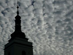 Church spire in dramatic sky