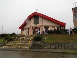 crowd of people at entrance to Catholic Church