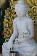 white sculpture of a buddha in a temple in bandarban