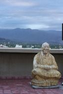wooden buddha statue on the upper terrace