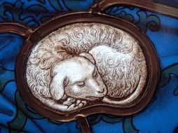 stained glass lamb figure, sacrifice symbol