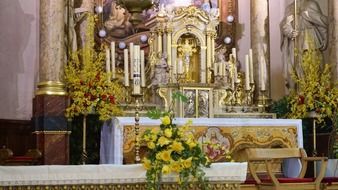 christian church altar decorated with flowers