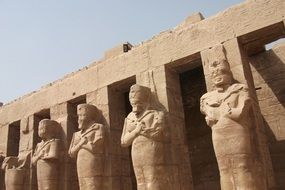 ancient statues of pharaohs at temple, egypt, luxor