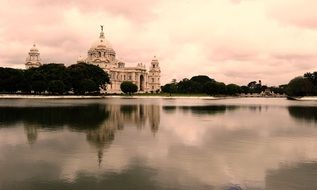 victoria memorial with reflexion on lake at evening, india, Kolkata