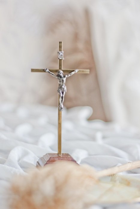 crucifix on white tissue