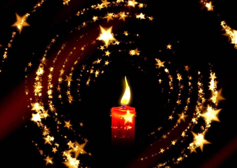 burning candle surrounded by stars