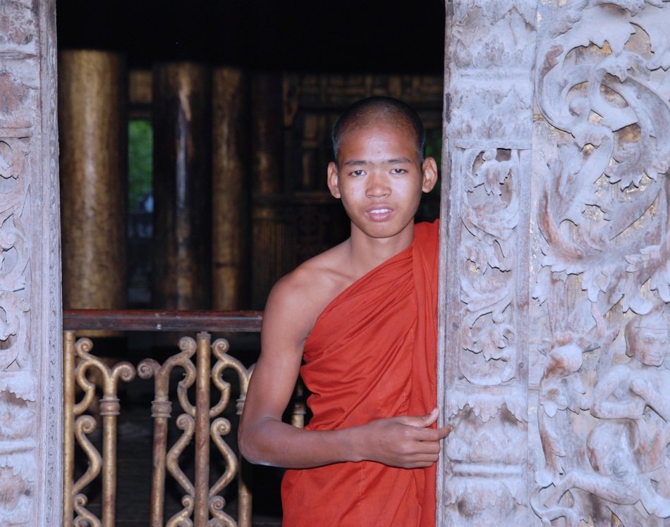 monk at the pillar of the temple in Myanmar