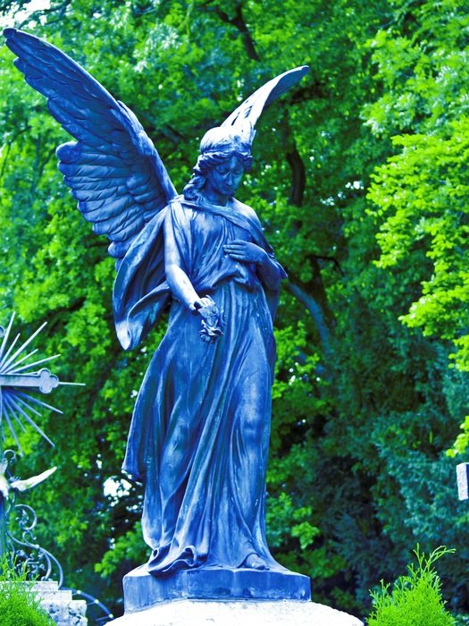 blue angel statue in the park