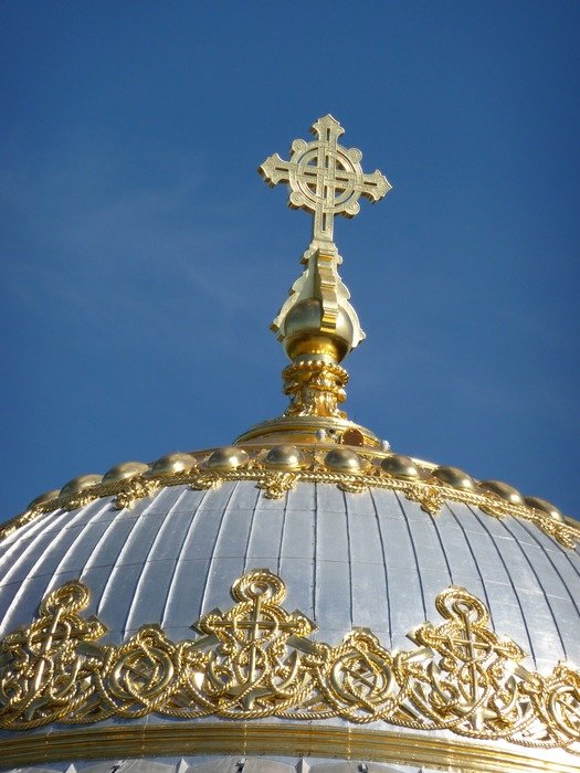 golden cross on the dome of the cathedral in St. Petersburg