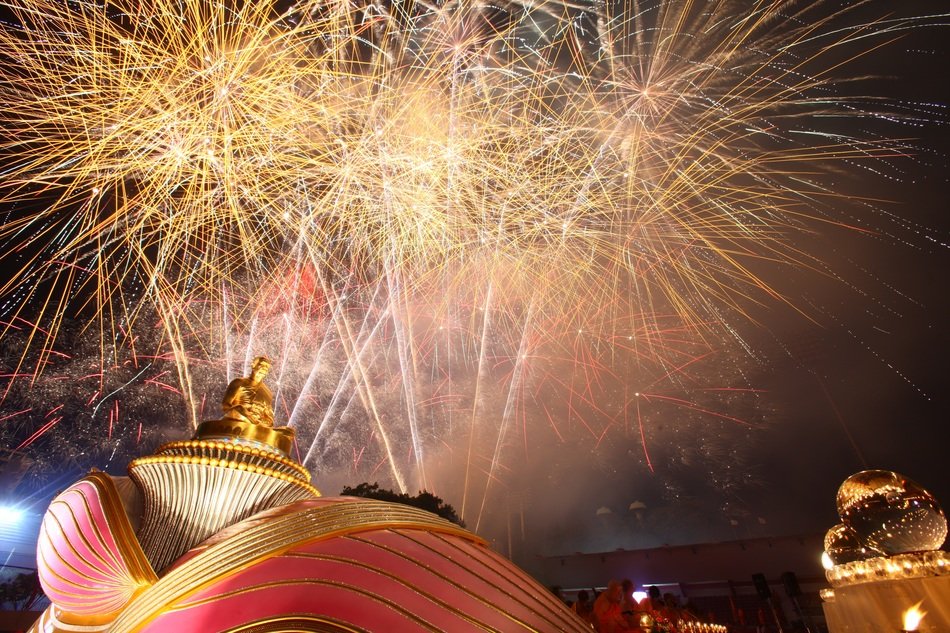buddha statue on the background of fireworks