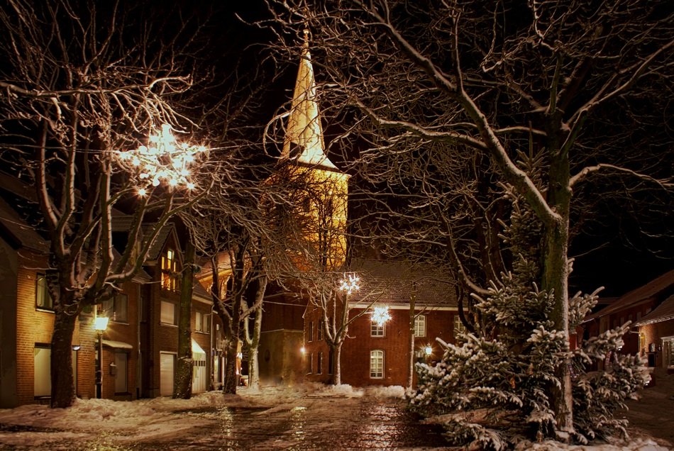 Christmas decorations on the street against the background of the church